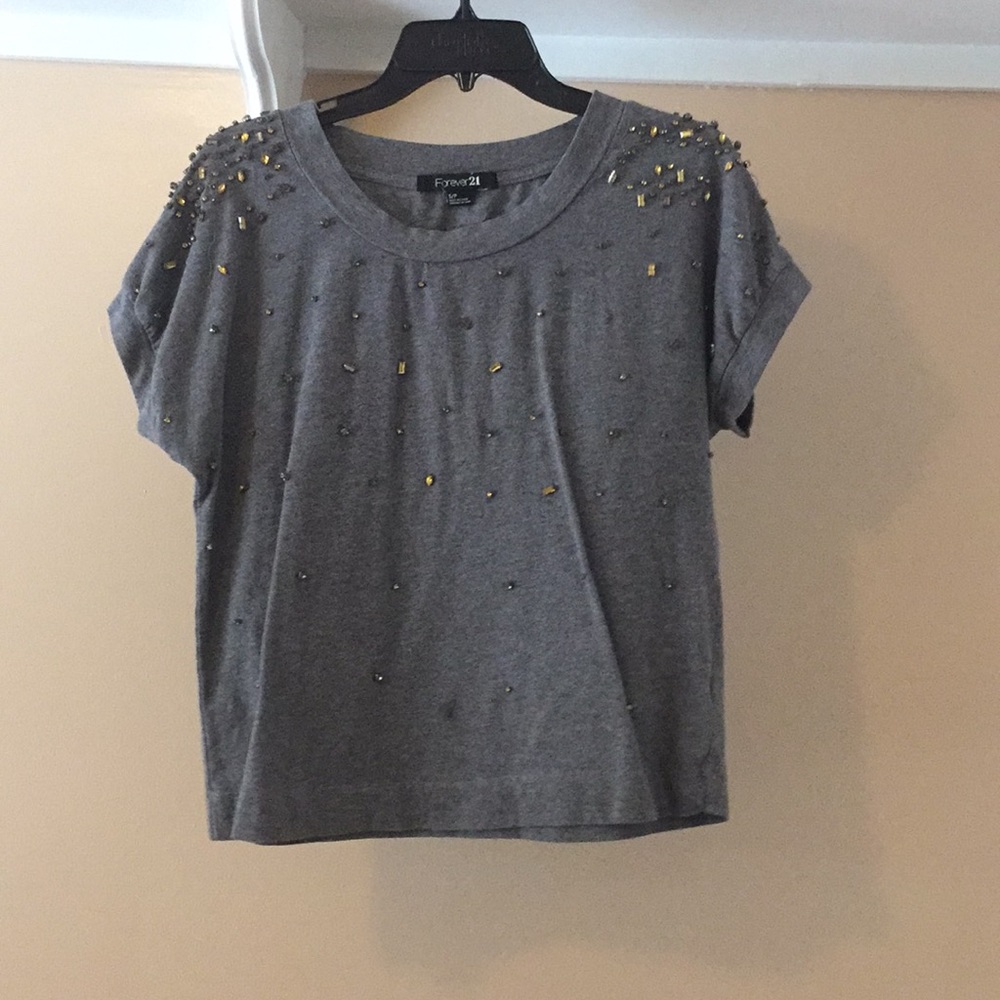 Gray top with little jewels on it